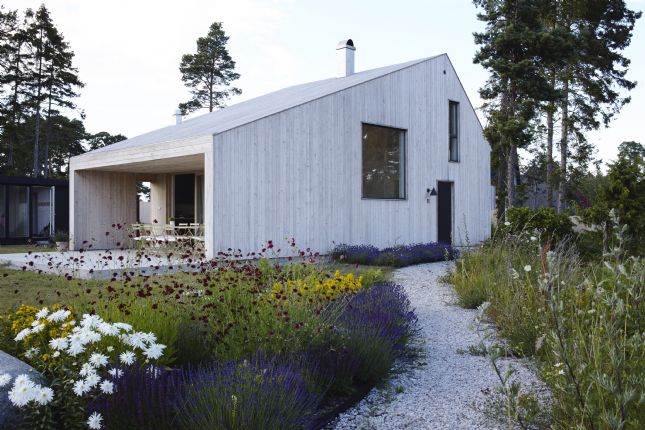 Sioox_Haus_mit_blumenHWfkyKU7AZQVE Sioox_Haus_mit_blumen_Fassade